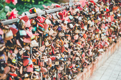 Close-up of padlocks hanging on railing