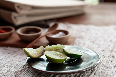 Close-up of fruits in plate on table