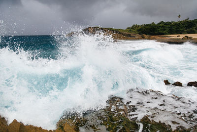 Waves splashing on rocks