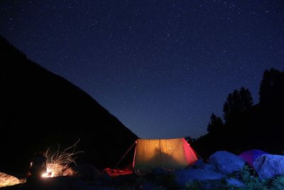 Tent on landscape at night