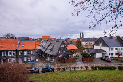 Buildings in town against sky