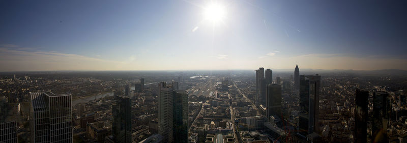 Aerial view of modern buildings in city against sky