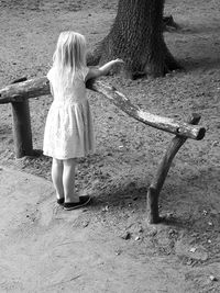 Rear view of girl standing outdoors