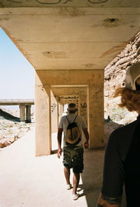 Rear view of man standing against sky