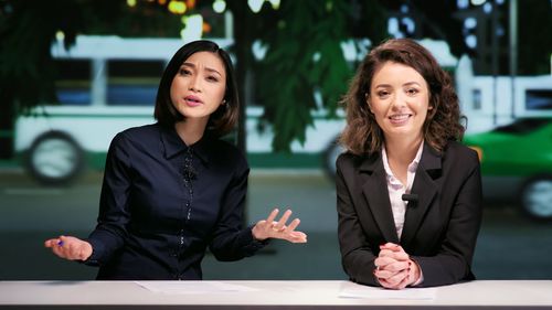 Portrait of smiling young businesswoman standing in office