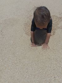 Boy in sand at beach