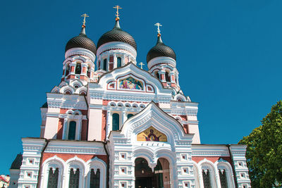 Low angle view of building against blue sky