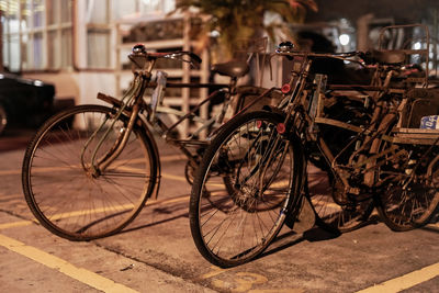 Bicycles parked on footpath in parking lot