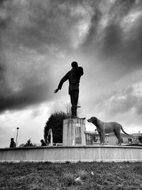 Statue of liberty against cloudy sky