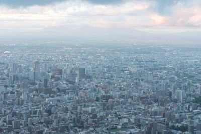 Aerial view of residential district against sky