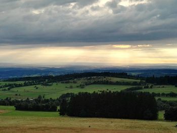 Scenic view of landscape against cloudy sky