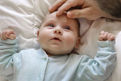 Father with his daughter, tiny infant. newborn baby smiling, laughing and looking up at daddy. 