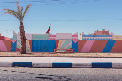 Multi colored buildings against blue sky