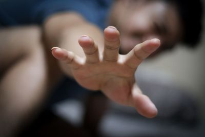 Defocused image of man gesturing