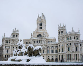 Historic building against sky during winter