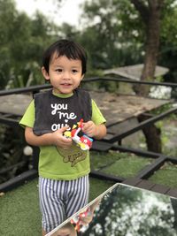 Cute boy standing outdoors