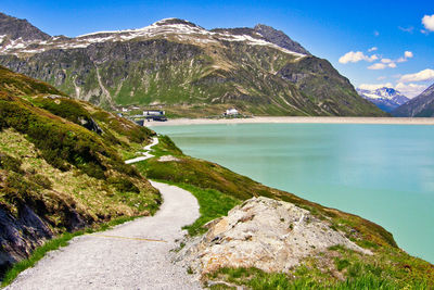 Scenic view of lake and mountains against sky