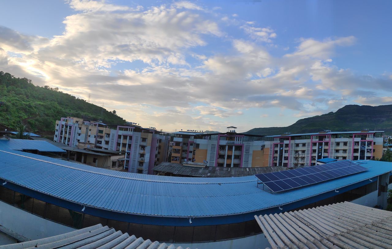 HIGH ANGLE VIEW OF BUILDING AGAINST SKY