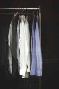 Clothes hanging on rack in store