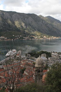 Scenic view of lake by buildings against sky