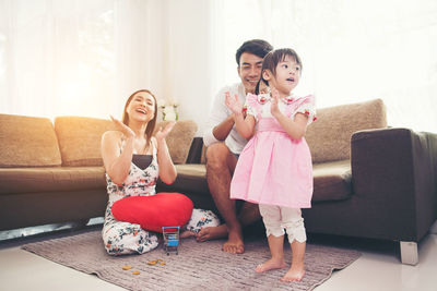 Family clapping at home