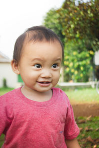 Portrait of cute girl standing outdoors