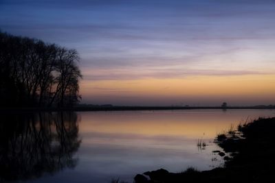 Scenic view of lake during sunset