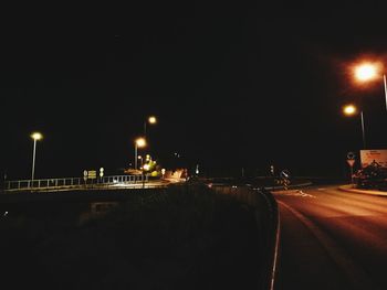 Illuminated road at night