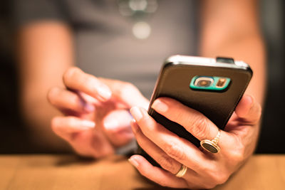 Close-up of woman using mobile phone