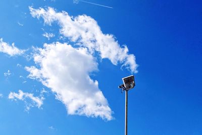 Low angle view of street light against blue sky