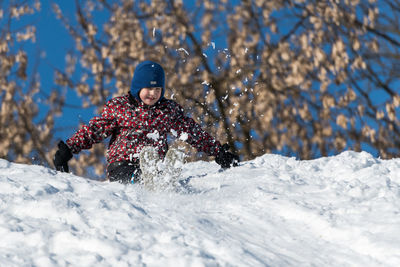 Man skiing on snow covered field