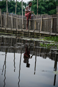 Man standing by lake