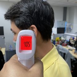 Cropped hand of person checking temperature