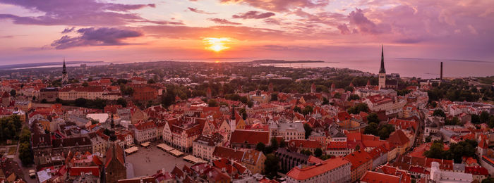 Panoramic view of old tallinn city at purple sunset, estonia.