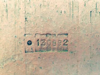 Close-up of text on wall