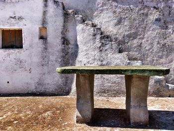 Table against old house in town