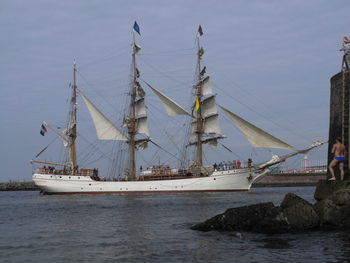 Sailboat on sea against sky