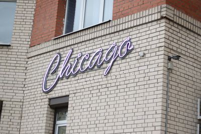 Low angle view of text on building wall