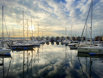 Boats moored at harbor