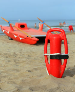 View of red boat on beach