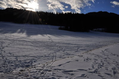 Scenic view of snow field against sky