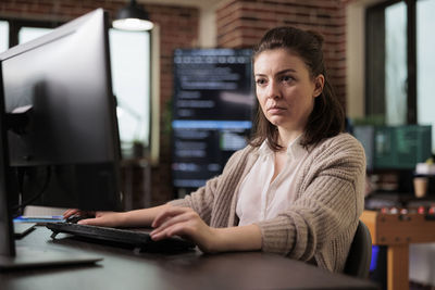 Thoughtful businesswoman working at office