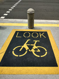 High angle view of bicycle lane sign on street