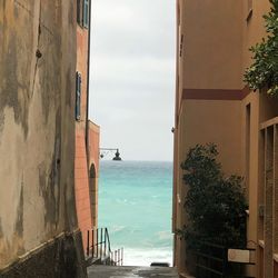 Scenic view of sea against sky seen through window