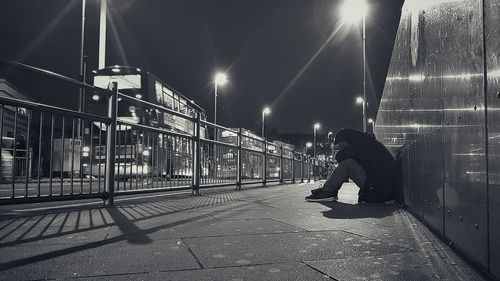 Man in city at night