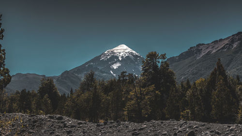 Scenic view of snowcapped mountains against clear sky