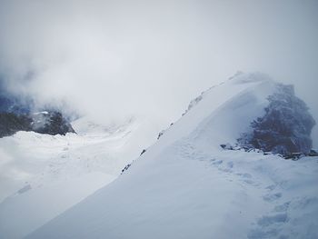 Scenic view of snowcapped mountain against sky