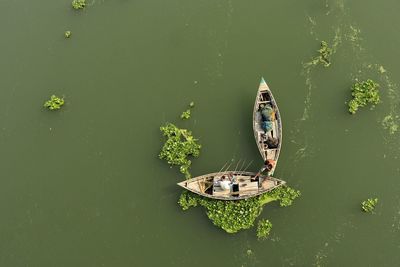 High angle view of boat floating on lake