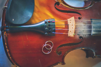 Close-up of rings on violin