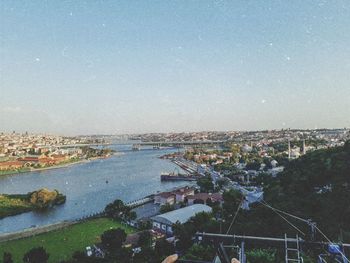 High angle view of river by buildings against sky